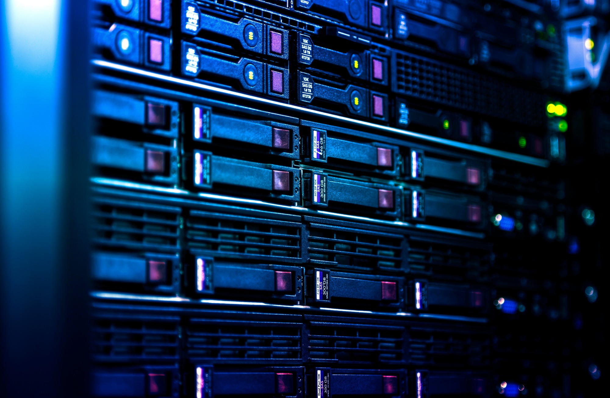 Close-up of a data server with illuminated components, showcasing multiple storage drives. Relevant for discussions on technology and data management.